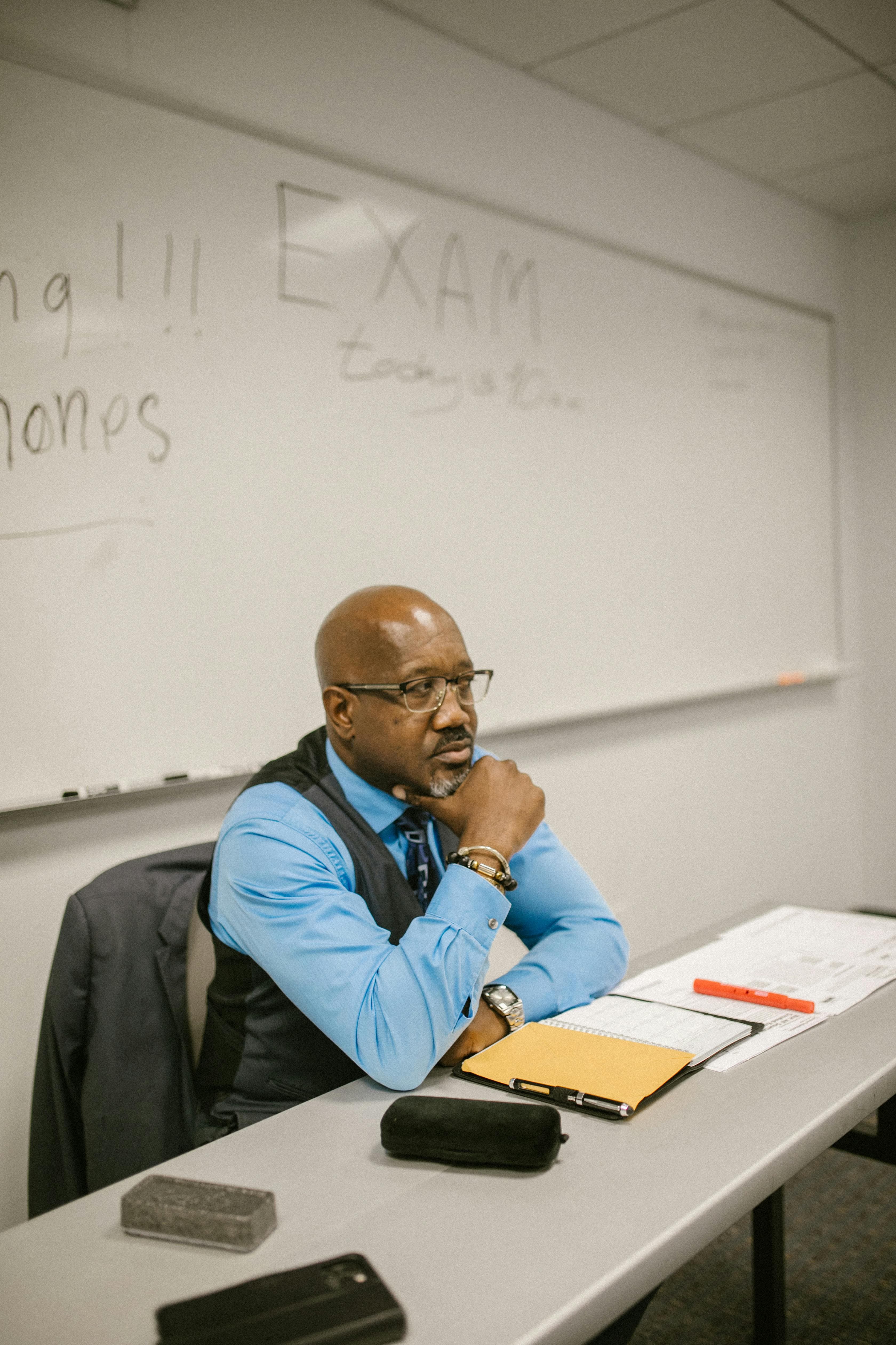 Teacher working at a whiteboard with students